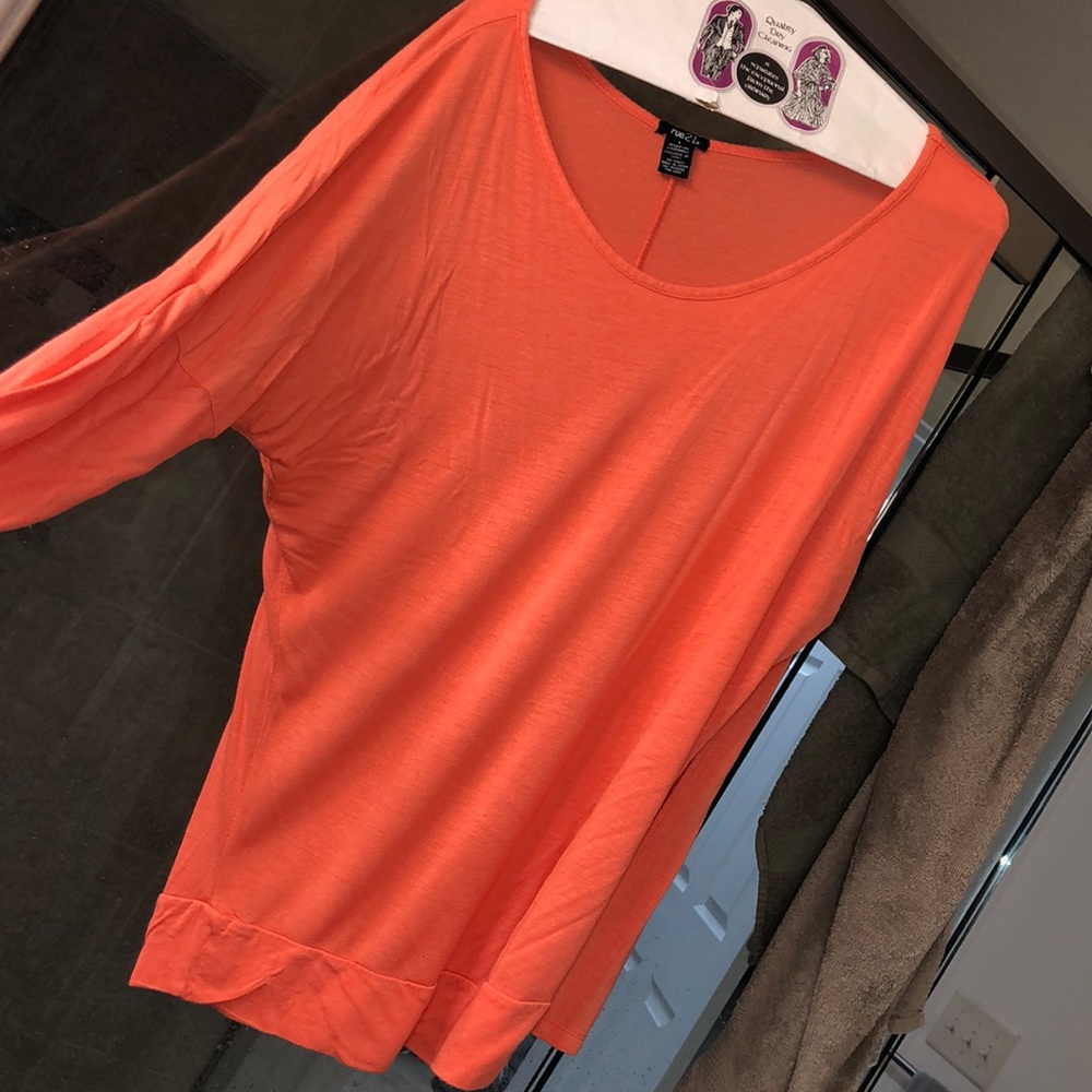 Long sleeve orange top.